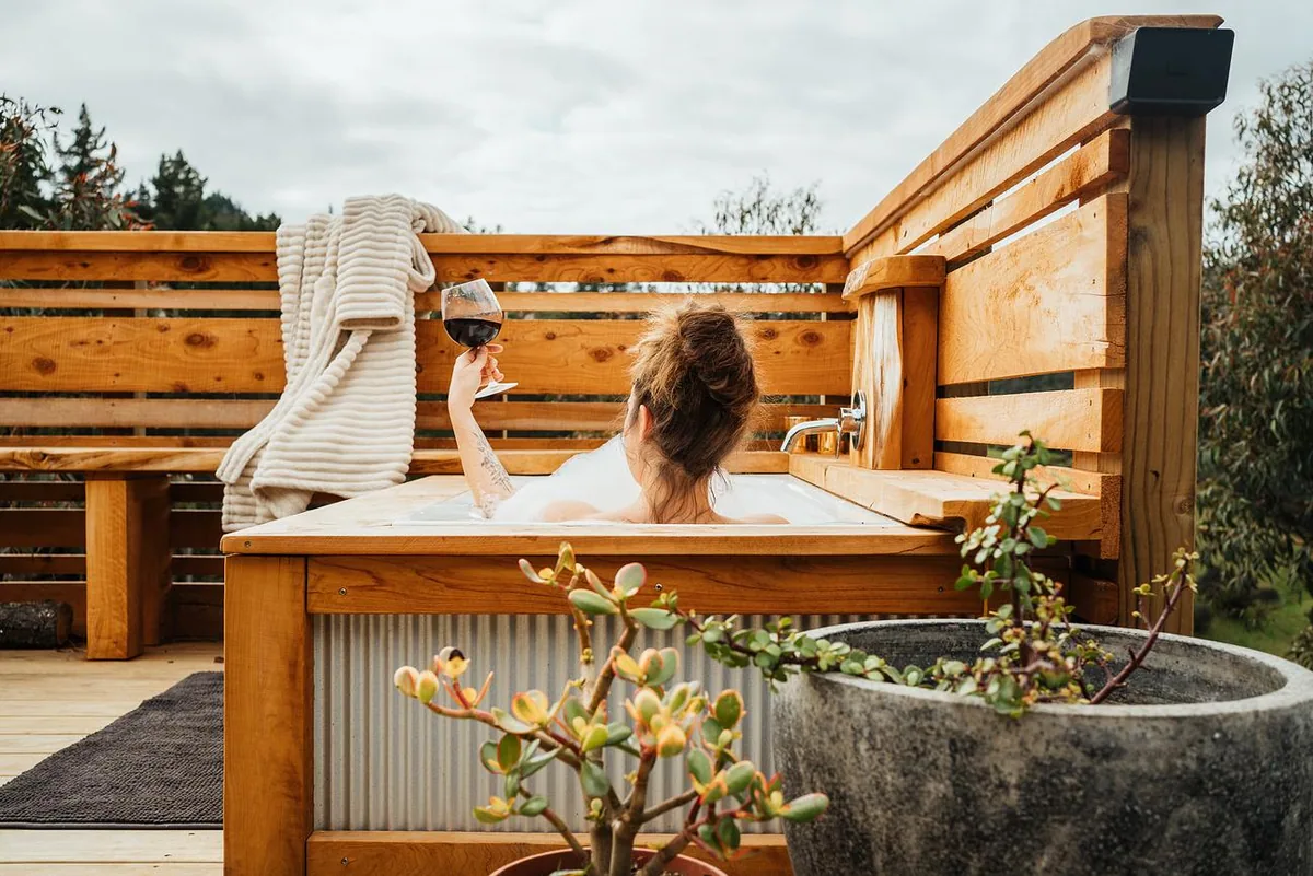 Relaxing in the outdoor bath with a glass of local wine