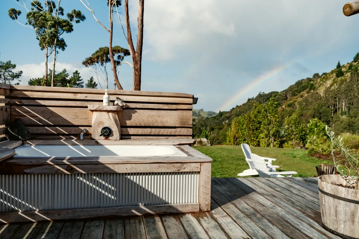 The outdoor bath, with a rainbow over the valley