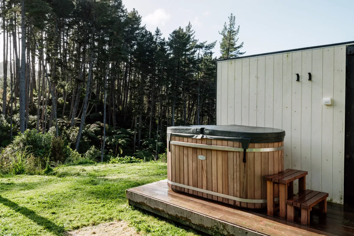 The cedar hot tub on its own deck