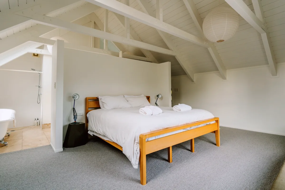 The master bedroom under the white trusses